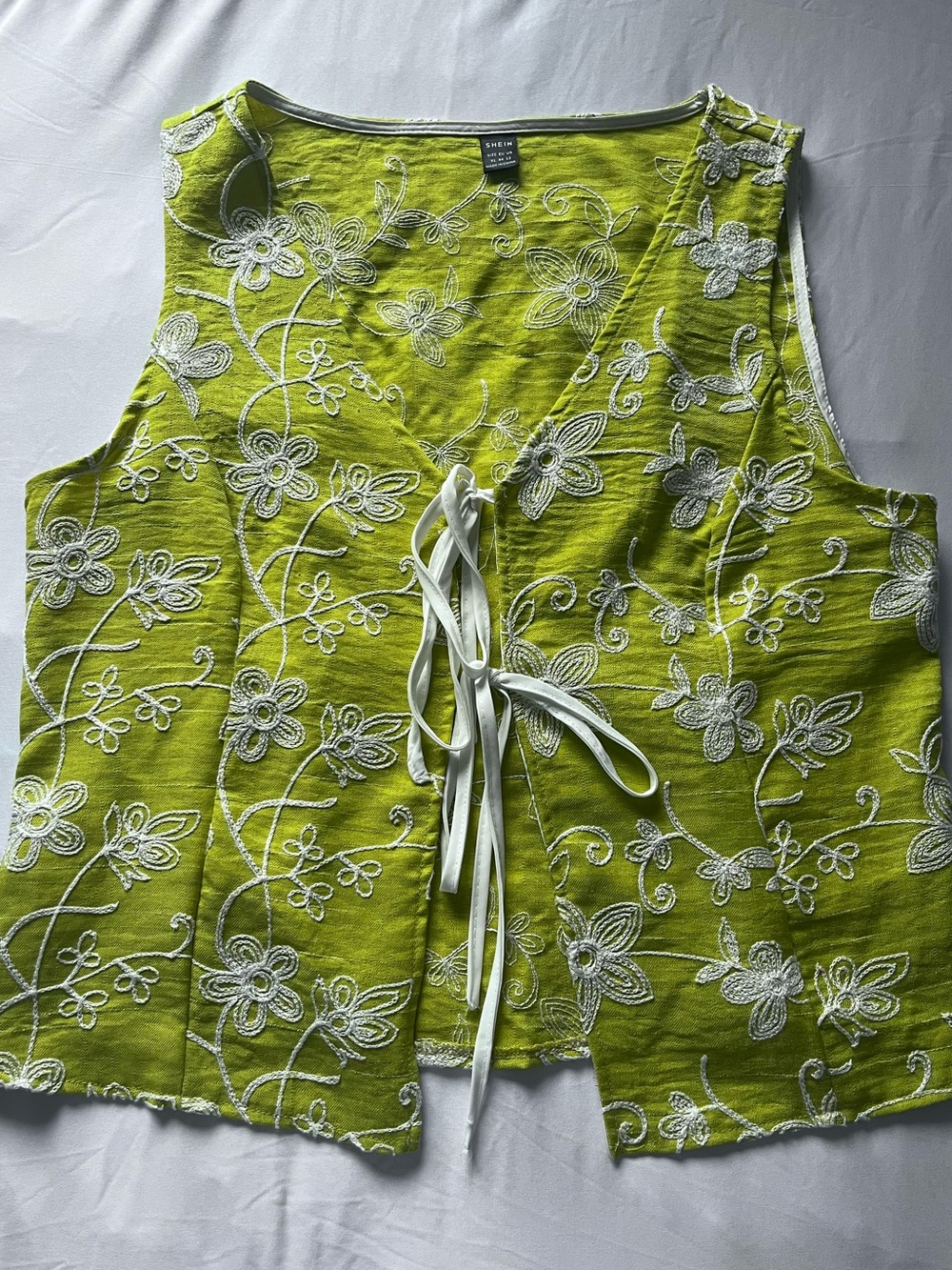 green embroidered tie up vest